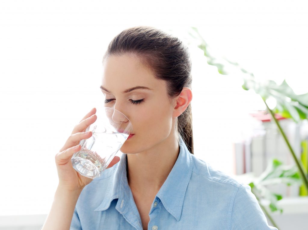 Woman drinking alkaline water