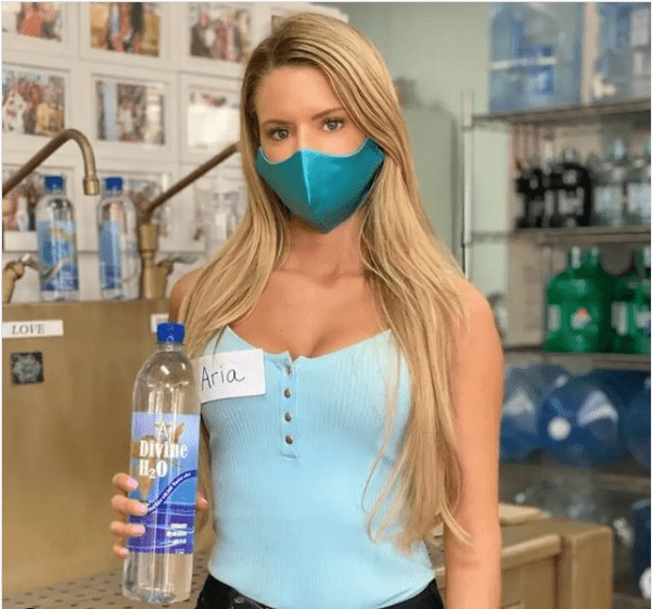 Aria holding a ADivineH2O bottle